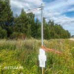 Paattilammentien viitta ja kohde-esite opastavat myytävälle Reuhto-metsätilalle.